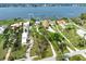 Aerial view showcasing a property's expansive waterfront lot, landscaping and surrounding neighborhood at 1784 Bayshore Dr, Englewood, FL 34223