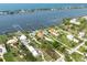 Aerial view showcases the prime real estate lots along the waterfront at 1784 Bayshore Dr, Englewood, FL 34223