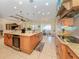 Large kitchen island with granite countertops and stainless steel appliances at 1784 Bayshore Dr, Englewood, FL 34223