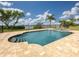 Inviting swimming pool with a spa and a large patio area at 1784 Bayshore Dr, Englewood, FL 34223