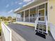 Inviting screened porch with stairs, ideal for outdoor relaxation and entertainment at 1784 Bayshore Dr, Englewood, FL 34223