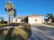 House exterior featuring a well-maintained lawn, driveway, and basketball hoop at 1789 Elm Dr, Venice, FL 34293