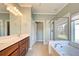 Elegant bathroom with double vanity, soaking tub, and shower at 19374 Rizzuto St, Venice, FL 34293