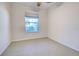 Well-lit bedroom with ceiling fan and window at 19374 Rizzuto St, Venice, FL 34293