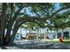 Outdoor seating under large tree near food trucks at 19374 Rizzuto St, Venice, FL 34293