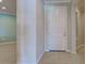 Interior entry with white door and tile floor at 19374 Rizzuto St, Venice, FL 34293
