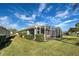 House exterior with screened patio at 19374 Rizzuto St, Venice, FL 34293