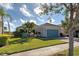 Landscaped front yard with lush greenery and paver walkway at 19374 Rizzuto St, Venice, FL 34293