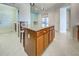 Kitchen island with granite top and wooden cabinets at 19374 Rizzuto St, Venice, FL 34293