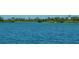 Serene view of a lake and waterfront gazebo at 19374 Rizzuto St, Venice, FL 34293