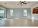 Bright living room with tile floors and sliding glass doors leading to a patio at 19374 Rizzuto St, Venice, FL 34293