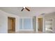 Living room with neutral walls, tile floors, and access to other rooms at 19374 Rizzuto St, Venice, FL 34293