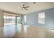 Living area with tile floors, sliding doors, and water view at 19374 Rizzuto St, Venice, FL 34293