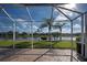 Spacious screened patio overlooking a lake at 19374 Rizzuto St, Venice, FL 34293