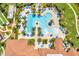 Resort-style pool with expansive sundeck and lush landscaping at 23108 Banbury Way # 202, Venice, FL 34293