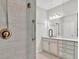 Modern bathroom with double vanity and shower at 23108 Banbury Way # 202, Venice, FL 34293