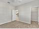 Bright bedroom with a view of the kitchen and a walk-in closet at 23108 Banbury Way # 202, Venice, FL 34293