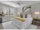 Main bedroom with plush bed and lake view at 23108 Banbury Way # 202, Venice, FL 34293