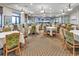 Elegant dining room with ample seating for residents and guests at 23108 Banbury Way # 202, Venice, FL 34293