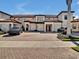 Townhome with two-car garage and brick paver driveway at 23108 Banbury Way # 202, Venice, FL 34293