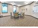 Relaxing game room with comfortable seating and a circular game table at 23108 Banbury Way # 202, Venice, FL 34293