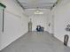 Spacious garage with ample storage space and epoxy flooring at 23108 Banbury Way # 202, Venice, FL 34293