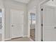 Bright hallway with access to bedrooms and bathroom at 23108 Banbury Way # 202, Venice, FL 34293