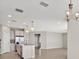 Open concept kitchen with island and stainless steel appliances at 23108 Banbury Way # 202, Venice, FL 34293