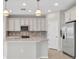Modern kitchen with stainless steel appliances and island at 23108 Banbury Way # 202, Venice, FL 34293
