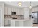 Modern kitchen with stainless steel appliances and an island at 23108 Banbury Way # 202, Venice, FL 34293