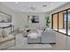 Bright living room with access to balcony and lake view at 23108 Banbury Way # 202, Venice, FL 34293