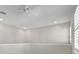 Loft bedroom with ceiling fan and window at 23108 Banbury Way # 202, Venice, FL 34293