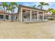 Relaxing poolside lounge area with shaded seating and a bar at 23108 Banbury Way # 202, Venice, FL 34293