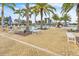 Resort-style pool area with lounge chairs and benches at 23108 Banbury Way # 202, Venice, FL 34293