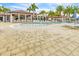 Community pool with expansive deck and seating at 23108 Banbury Way # 202, Venice, FL 34293