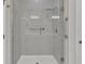Walk-in shower with glass enclosure and grab bars at 23108 Banbury Way # 202, Venice, FL 34293