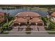 Luxury 3-car garage home with lakefront view at sunset at 23471 Awabuki Dr, Venice, FL 34293