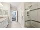 Spa-like bathroom with a walk-in shower and double vanity at 23471 Awabuki Dr, Venice, FL 34293