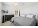 Comfortable bedroom with a king-size bed and a dresser at 23471 Awabuki Dr, Venice, FL 34293