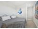 Spacious bedroom with a king-size bed and nautical decor at 23471 Awabuki Dr, Venice, FL 34293