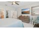 King size bed, large TV, and ensuite bathroom access at 23471 Awabuki Dr, Venice, FL 34293