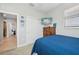 Bright bedroom with a large closet and TV at 23471 Awabuki Dr, Venice, FL 34293