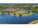 Resort-style pool and tennis courts with lake view at 23471 Awabuki Dr, Venice, FL 34293