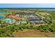 Aerial view of community amenities including tennis courts at 23471 Awabuki Dr, Venice, FL 34293