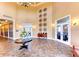 Elegant community clubhouse lobby with Palm Dining and Lounge areas at 23471 Awabuki Dr, Venice, FL 34293