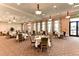 Bright dining room with large windows and many tables at 23471 Awabuki Dr, Venice, FL 34293