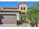 Two-story home with attached garage and landscaped entry at 23471 Awabuki Dr, Venice, FL 34293
