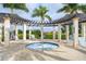 Tranquil hot tub surrounded by lounge chairs at 23471 Awabuki Dr, Venice, FL 34293