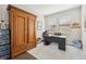 Home office with built-in wooden cabinet and workspace at 23471 Awabuki Dr, Venice, FL 34293