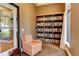 Cozy reading room with comfortable seating and large bookshelf at 23471 Awabuki Dr, Venice, FL 34293